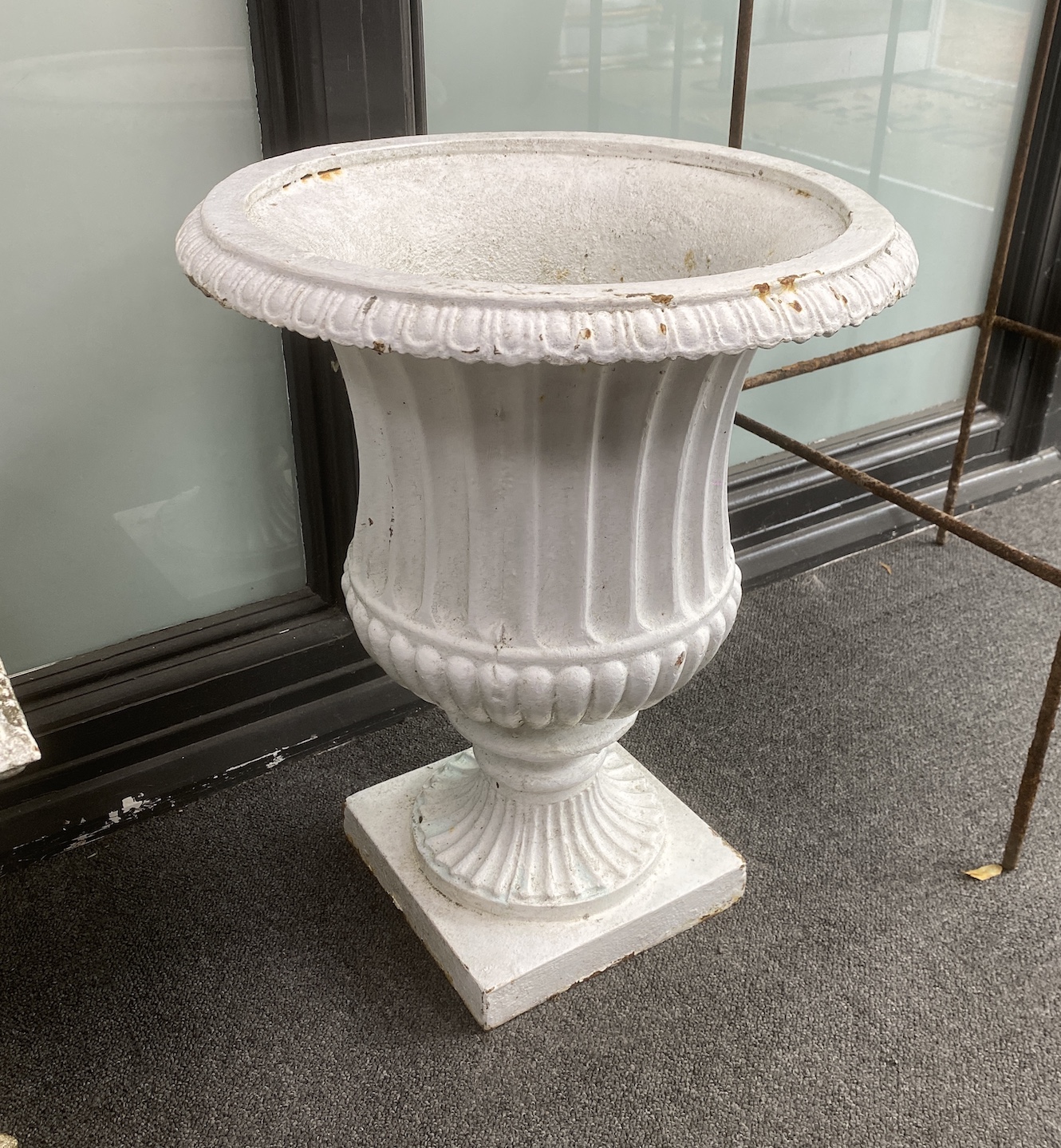A pair of Victorian cast iron campana garden urns, diameter 40cm, height 50cm